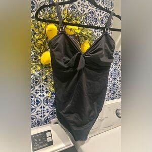 One piece, black swimsuit with underwire. Size 16.